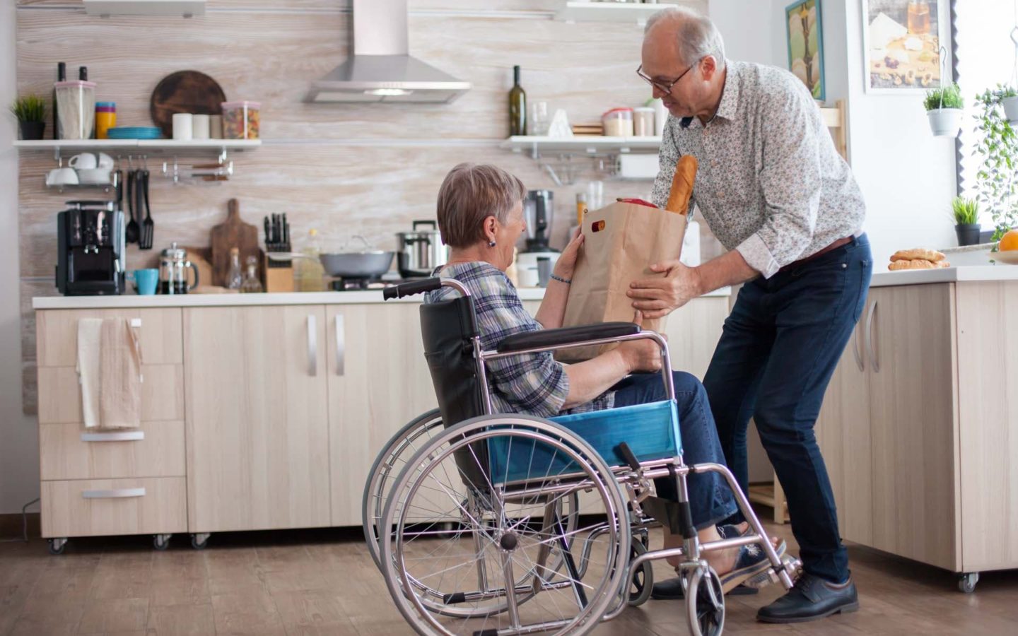 Elderly man helping woman with shopping