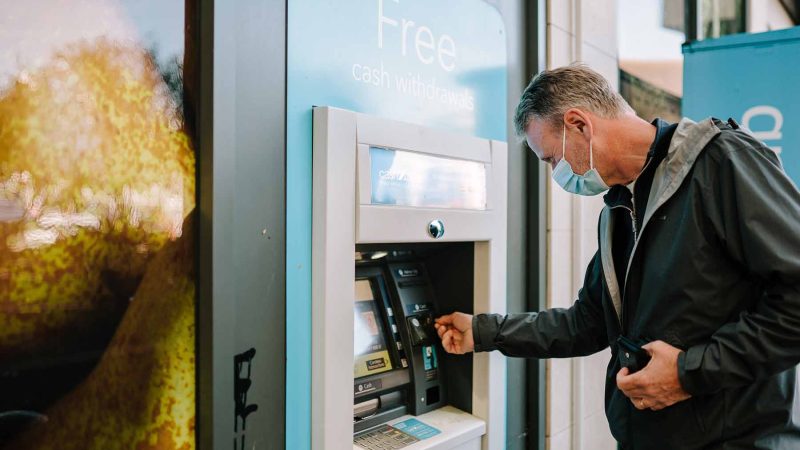 Older person using ATM